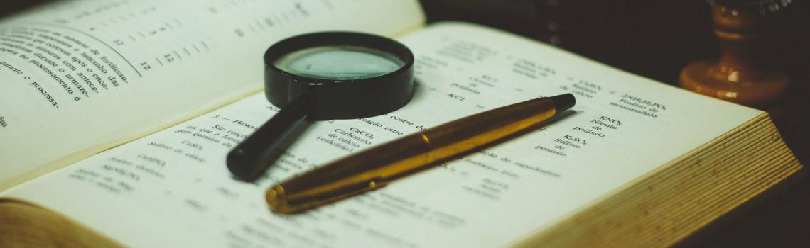 Magnifying glass on book